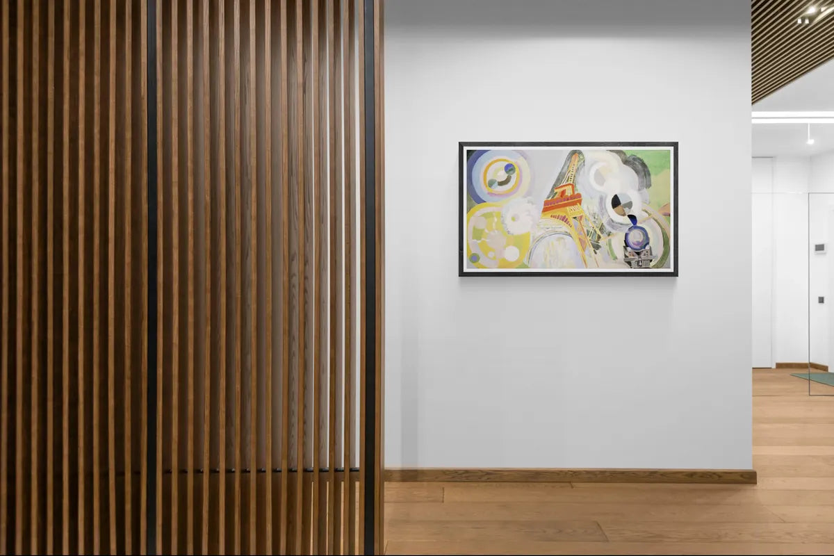 Robert Delaunay's Air, Fire and Water framed in black on a showroom wall beside timber slats