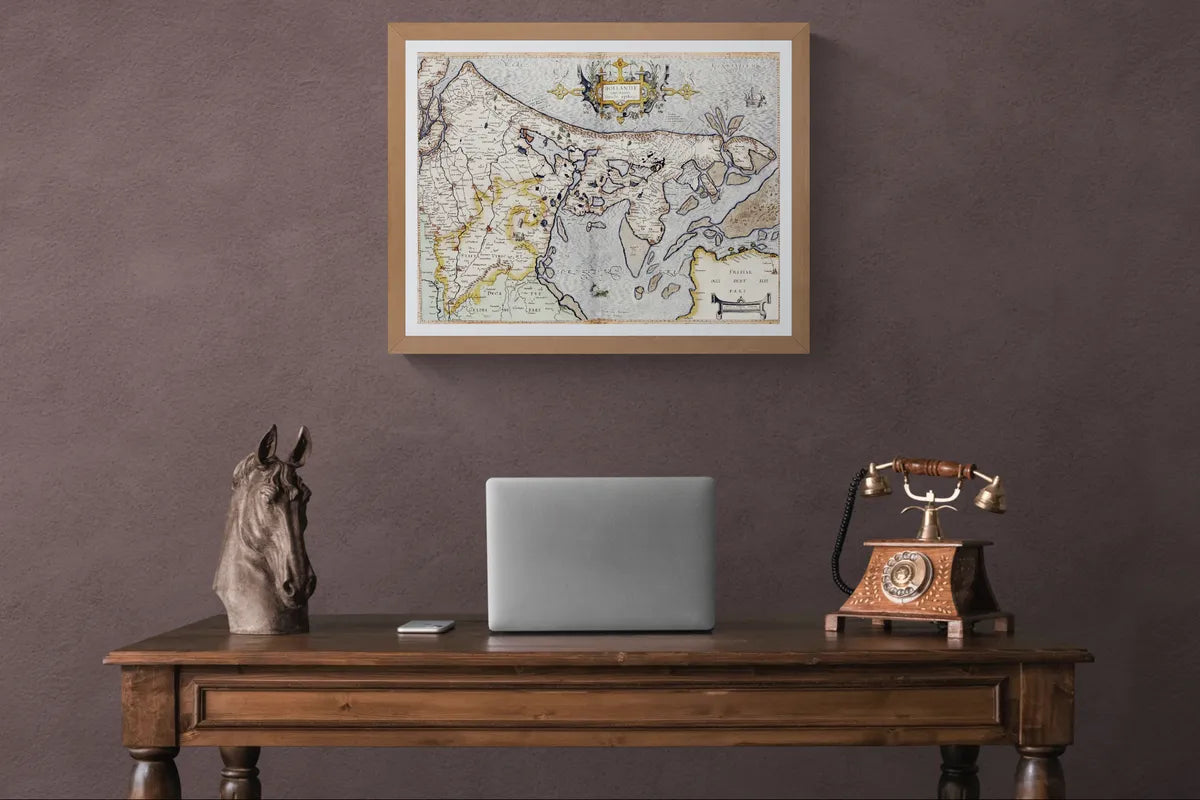 Rumold Mercator's Map of Holland in a walnut frame above a wooden writing desk