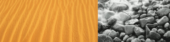 Split composition with golden sand dunes on left and black-and-white flowing water over rounded rocks on right.