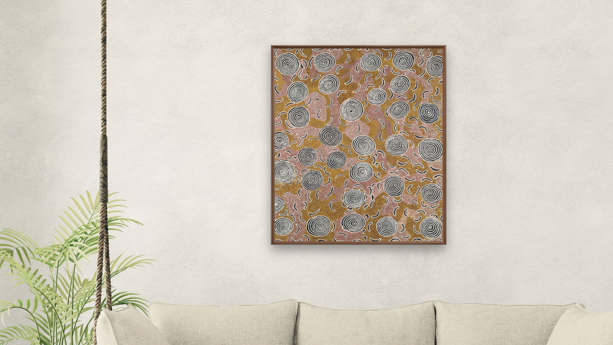 Water Dreaming by Johnny Warangkula Tjupurrula, shown at 32 × 40 in (81.3 × 101.6 cm) on canvas in Arber Warm Walnut, living