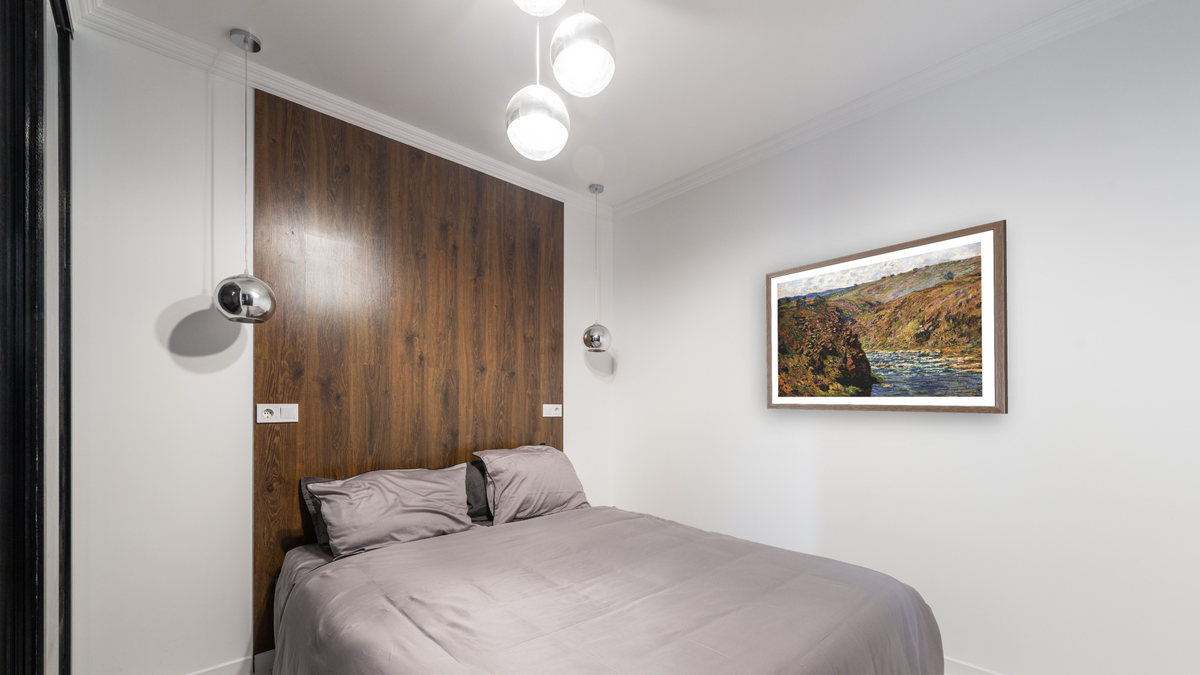 Valley of the Creuse (Sunlight Effect) by Claude Monet, shown at 29 × 42 in (73.7 × 106.7 cm) in Arber Light Walnut, bedroom
