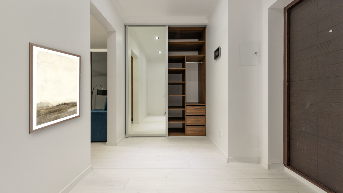 Away From Hear 1 by Dan Hobday, shown at 30 × 42 in (76.2 × 106.7 cm) in Arber Light Walnut, hallway