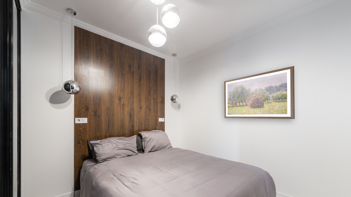 Grainstack by Claude Monet, shown at 27 × 42 in (68.6 × 106.7 cm) in Arber Light Walnut, bedroom