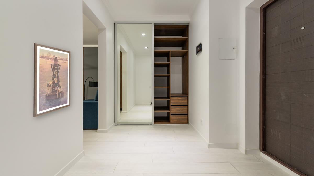 Now and Then: Franklin Library by Kirsten Söderlind, shown at 23 × 40 in (58.4 × 101.6 cm) in Arber Light Walnut, hallway