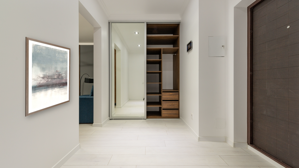 Drama 2 by Dan Hobday, shown at 30 × 42 in (76.2 × 106.7 cm) in Arber Light Walnut, hallway