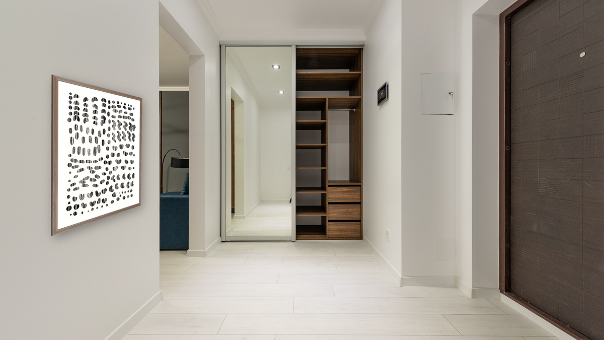 Pieces by Dan Hobday, shown at 30 × 42 in (76.2 × 106.7 cm) in Arber Light Walnut, hallway