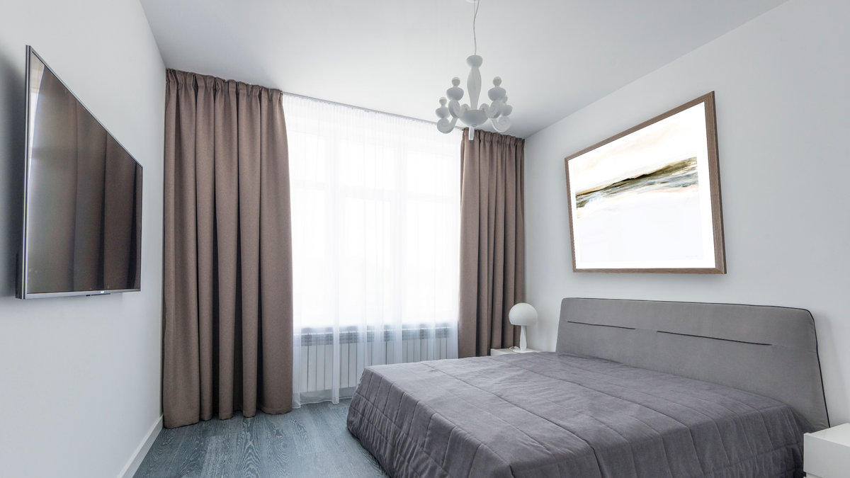 Orkney by Dan Hobday, shown at 32 × 32 in (81.3 × 81.3 cm) in Arber Light Walnut, bedroom
