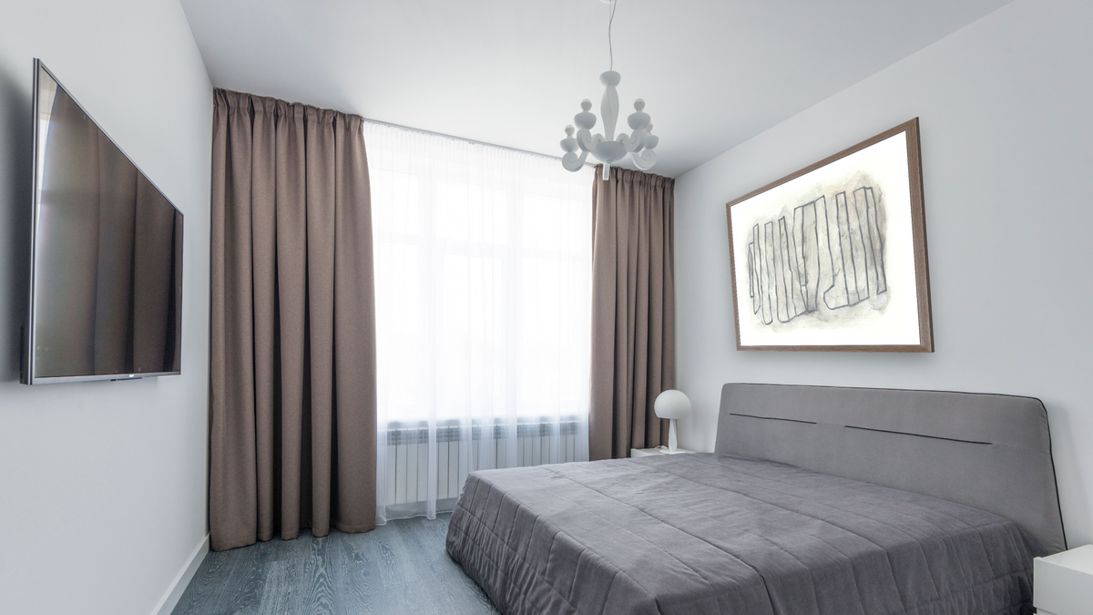 Carbon by Dan Hobday, shown at 32 × 32 in (81.3 × 81.3 cm) in Arber Light Walnut, bedroom