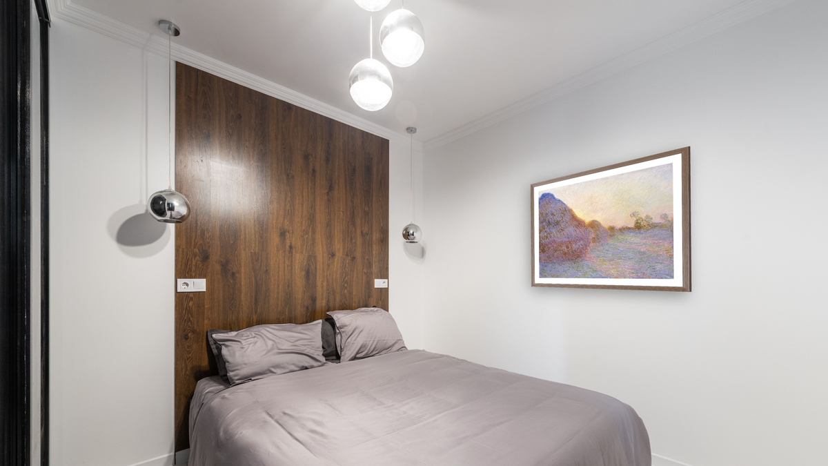 Haystacks by Claude Monet, shown at 32 × 40 in (81.3 × 101.6 cm) in Arber Light Walnut, bedroom