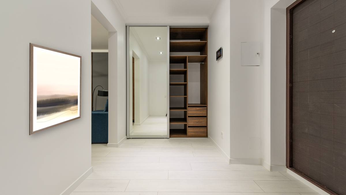 Forest View 1 by Dan Hobday, shown at 30 × 42 in (76.2 × 106.7 cm) in Arber Light Walnut, hallway