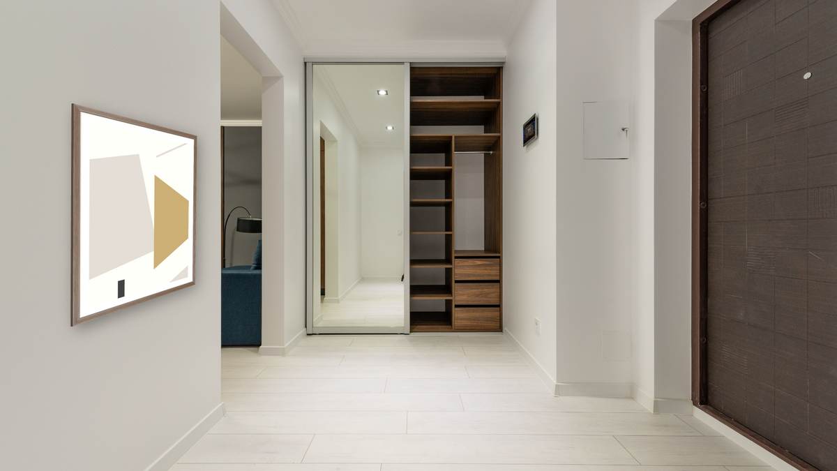 Geo Shapes 1 by Dan Hobday, shown at 30 × 42 in (76.2 × 106.7 cm) in Arber Light Walnut, hallway
