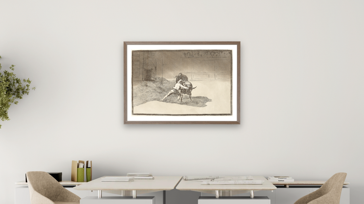 The Famous Martincho Places the Banderillas Playing the Bull with the Movement of His Body (El famoso Martincho poniendo banderillas al quiebro), from the series La Tauromaquia by Francisco de Goya, shown at 28 × 42 in (71.1 × 106.7 cm) in Arber Light Walnut, office