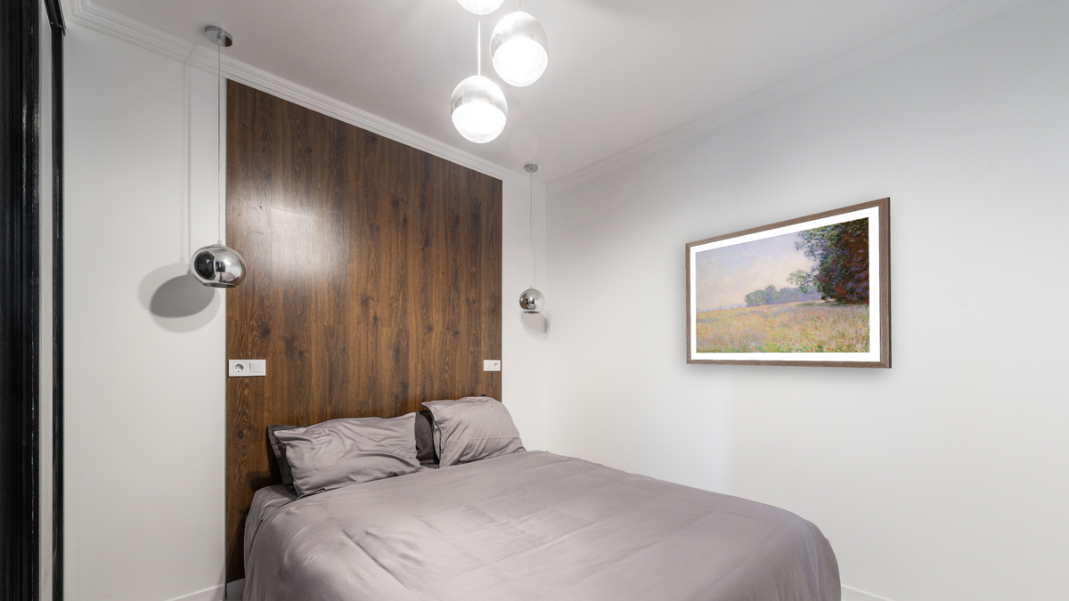 Champ d'avoine (Oat Field) by Claude Monet, shown at 29 × 40 in (73.7 × 101.6 cm) in Arber Light Walnut, bedroom
