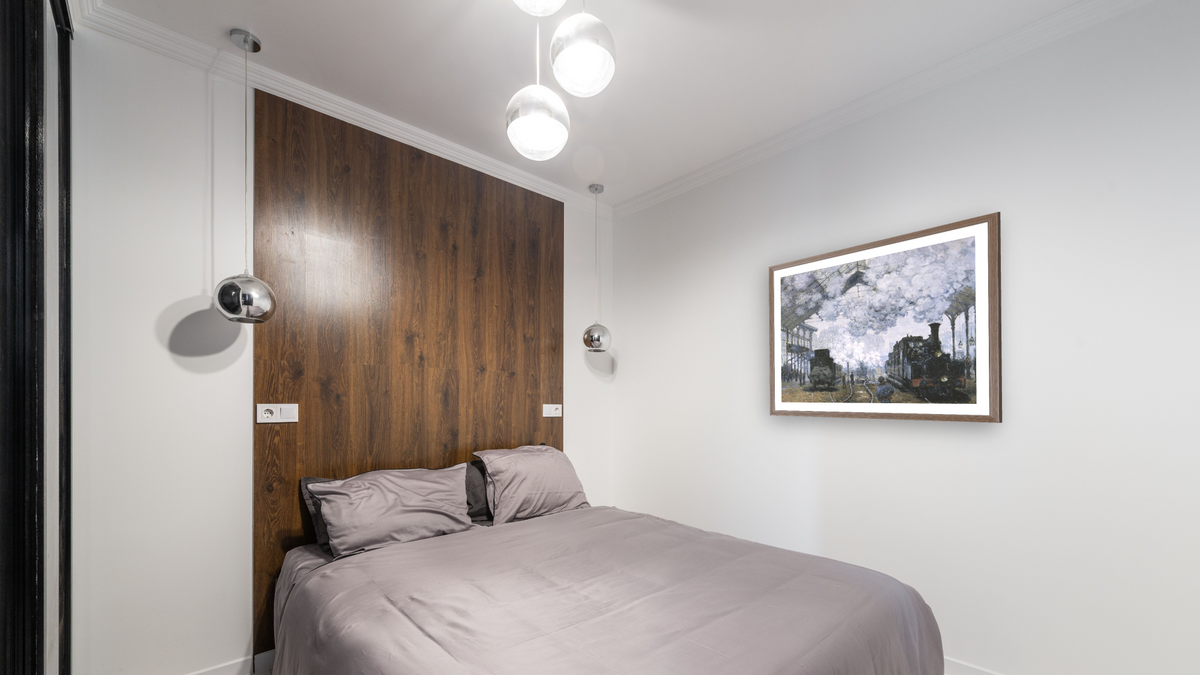 Gare Saint-Lazare by Claude Monet, shown at 32 × 40 in (81.3 × 101.6 cm) in Arber Light Walnut, bedroom
