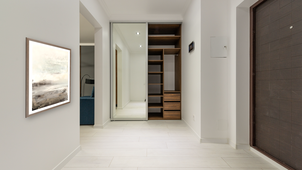 Down Tempo 1 by Dan Hobday, shown at 30 × 42 in (76.2 × 106.7 cm) in Arber Light Walnut, hallway