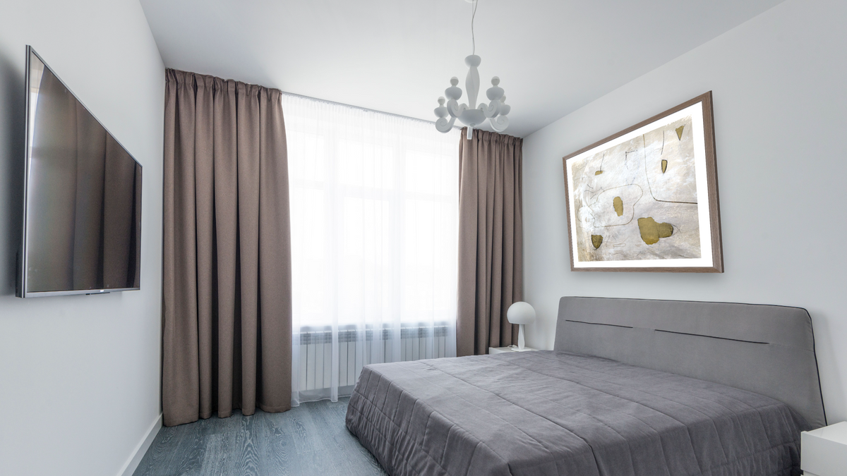 Perpetual by Dan Hobday, shown at 32 × 32 in (81.3 × 81.3 cm) in Arber Light Walnut, bedroom