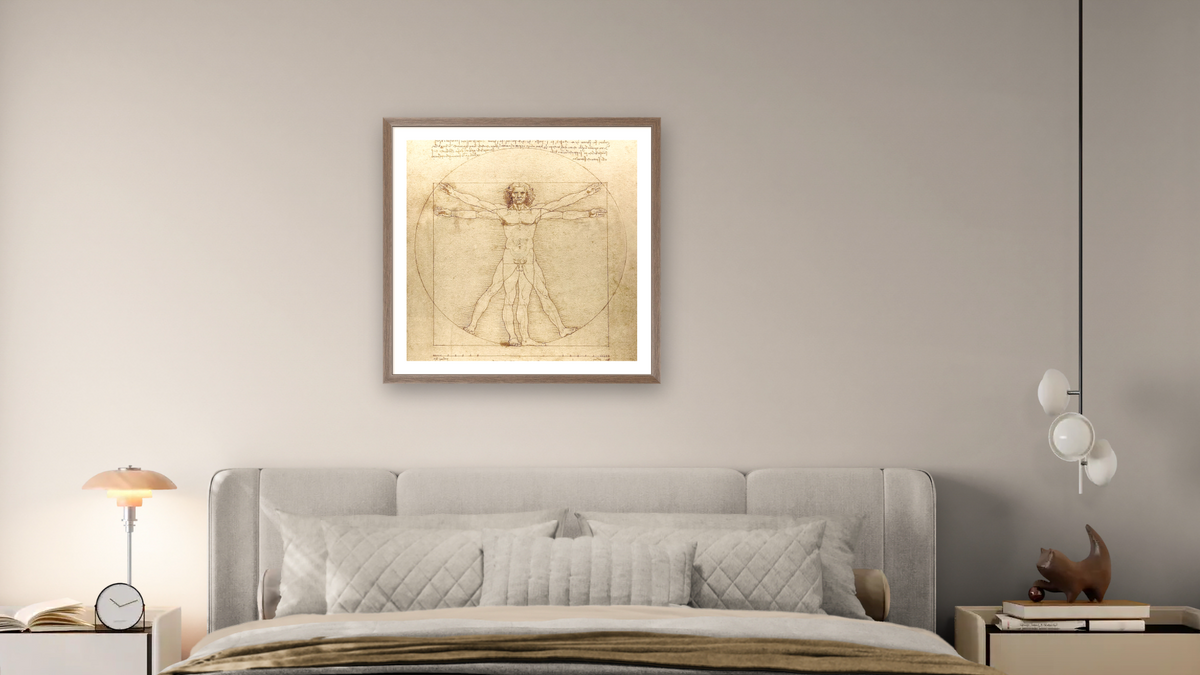 Vitruvian Man (Canon of Proportions) by Leonardo da Vinci, shown at 32 × 32 in (81.3 × 81.3 cm) in Arber Light Walnut, bedroom