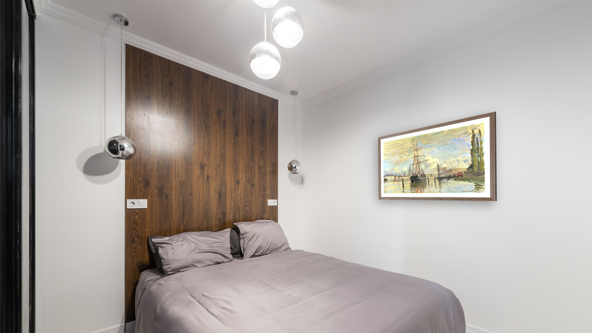 The Seine at Rouen by Claude Monet, shown at 27 × 42 in (68.6 × 106.7 cm) in Arber Light Walnut, bedroom