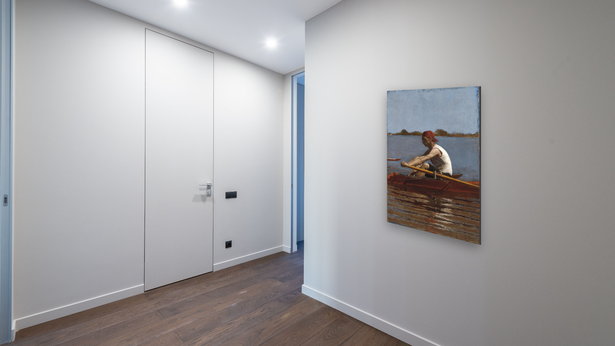 John Biglin in a Single Scull by Thomas Eakins, shown at 28 × 42 in (71.1 × 106.7 cm) as gallery-wrapped canvas, hallway