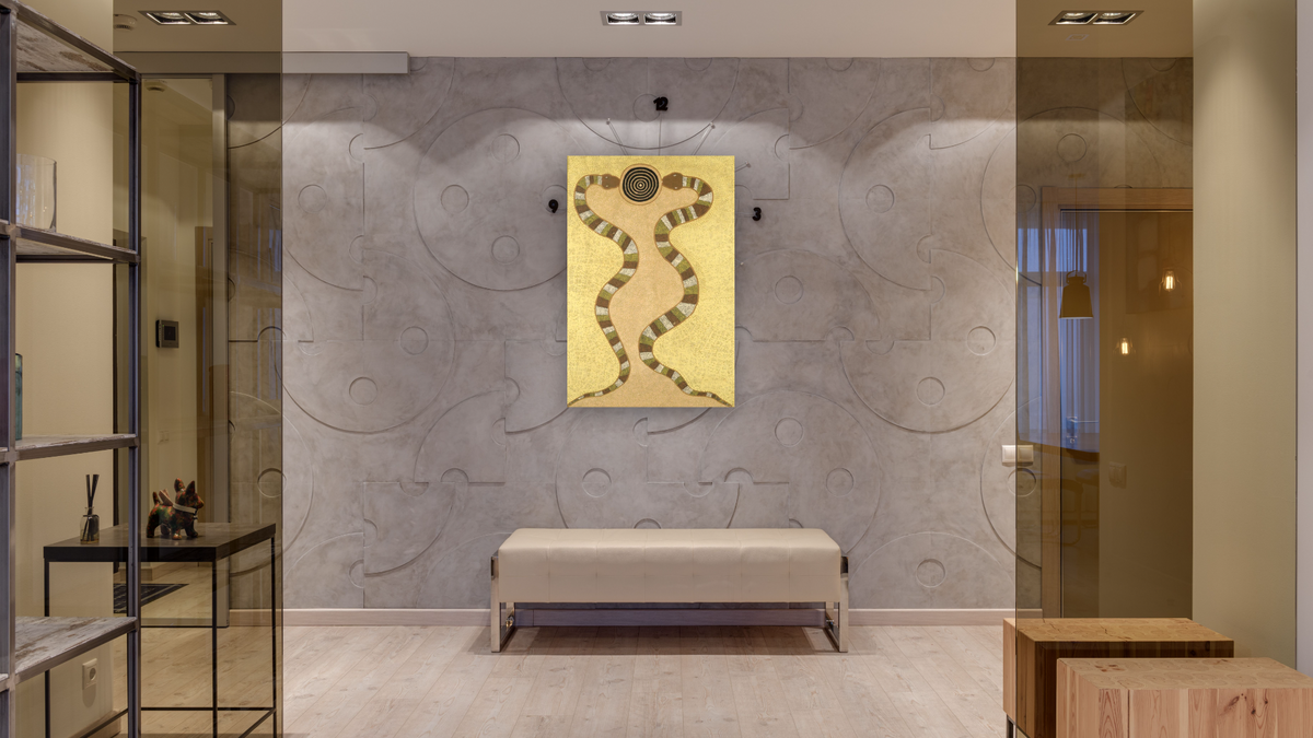 Snake Dreaming by Turkey Tolson Tjupurrula, shown at 28 × 42 in (71.1 × 106.7 cm) as gallery-wrapped canvas, hallway