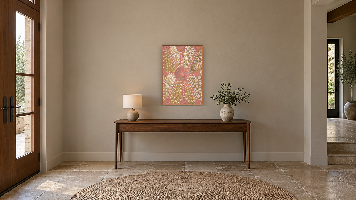 Water Dreaming by Long Jack Phillipus Tjakamarra, shown at 28 × 42 in (71.1 × 106.7 cm) on canvas in Arber Raw Oak, hallway