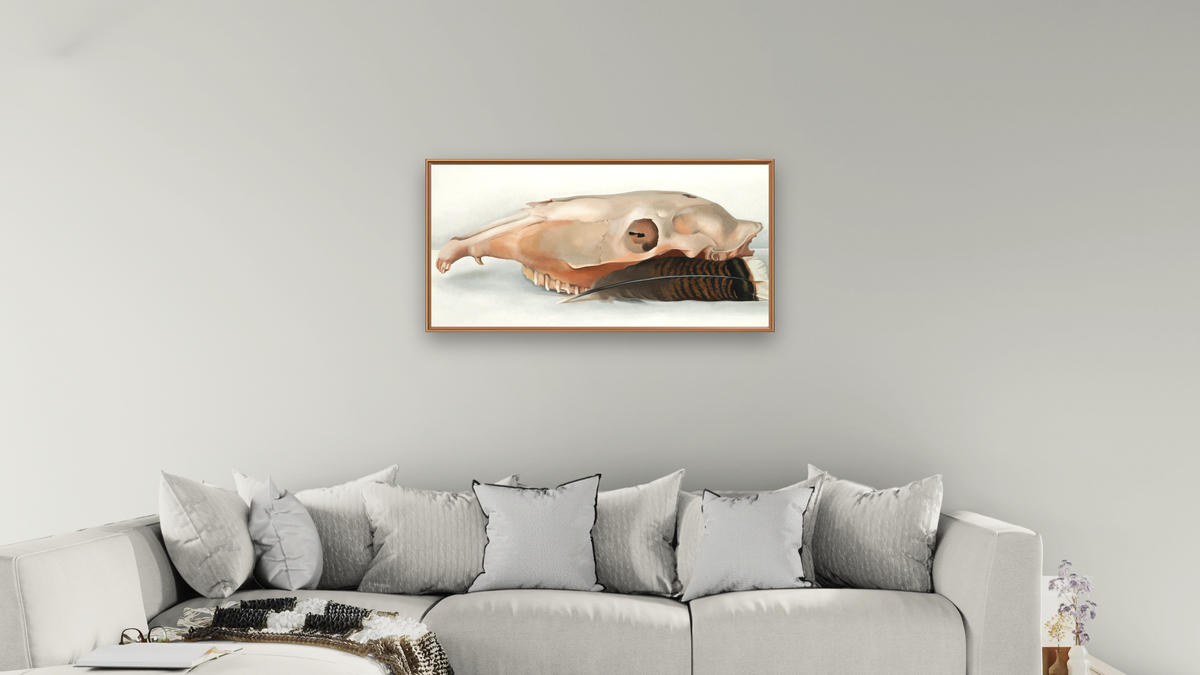Horizontal Horse's or Mule's Skull with Feather by Georgia O'Keeffe, shown at 20 × 40 in (50.8 × 101.6 cm) on canvas in Arber Raw Oak, living