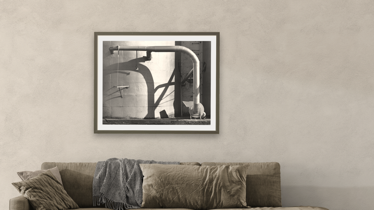 Arbuckle Warehouse #10 by Gordon Osmundson, shown at 32 × 40 in (81.3 × 101.6 cm) in Ramino Satin Black, living