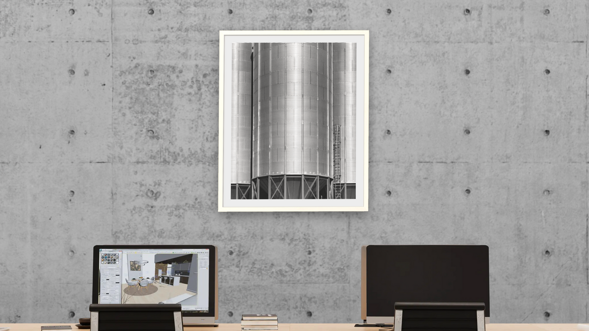 Corrugated Metal Silos #1 by Gordon Osmundson, shown at 32 × 40 in (81.3 × 101.6 cm) in Ramino Opaque White, office