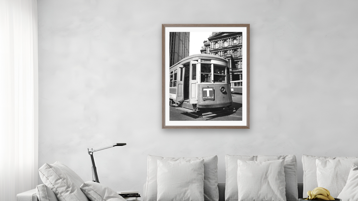 Old Post Office with Trolley - II, Park Row and Broadway, Manhattan by Berenice Abbott, shown at 30 × 40 in (76.2 × 101.6 cm) in Arber Light Walnut, living