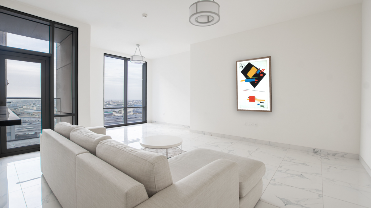Suprematist Painting (with Black Trapezium and Red Square), shown at 26 × 42 in (66 × 106.7 cm) in Arber Light Walnut, living