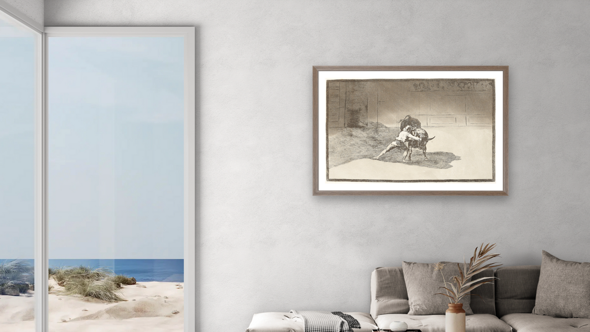 The Famous Martincho Places the Banderillas Playing the Bull with the Movement of His Body (El famoso Martincho poniendo banderillas al quiebro), from the series La Tauromaquia by Francisco de Goya, shown at 28 × 42 in (71.1 × 106.7 cm) in Arber Light Walnut, living