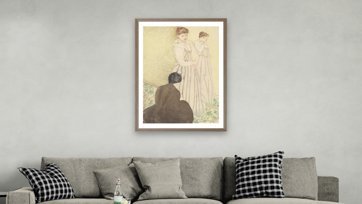 The Fitting by Mary Cassatt, shown at 28 × 42 in (71.1 × 106.7 cm) in Arber Light Walnut, living