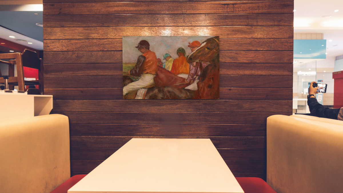 The Jockeys by Edgar Degas, shown at 28 × 42 in (71.1 × 106.7 cm) as gallery-wrapped canvas, restaurant