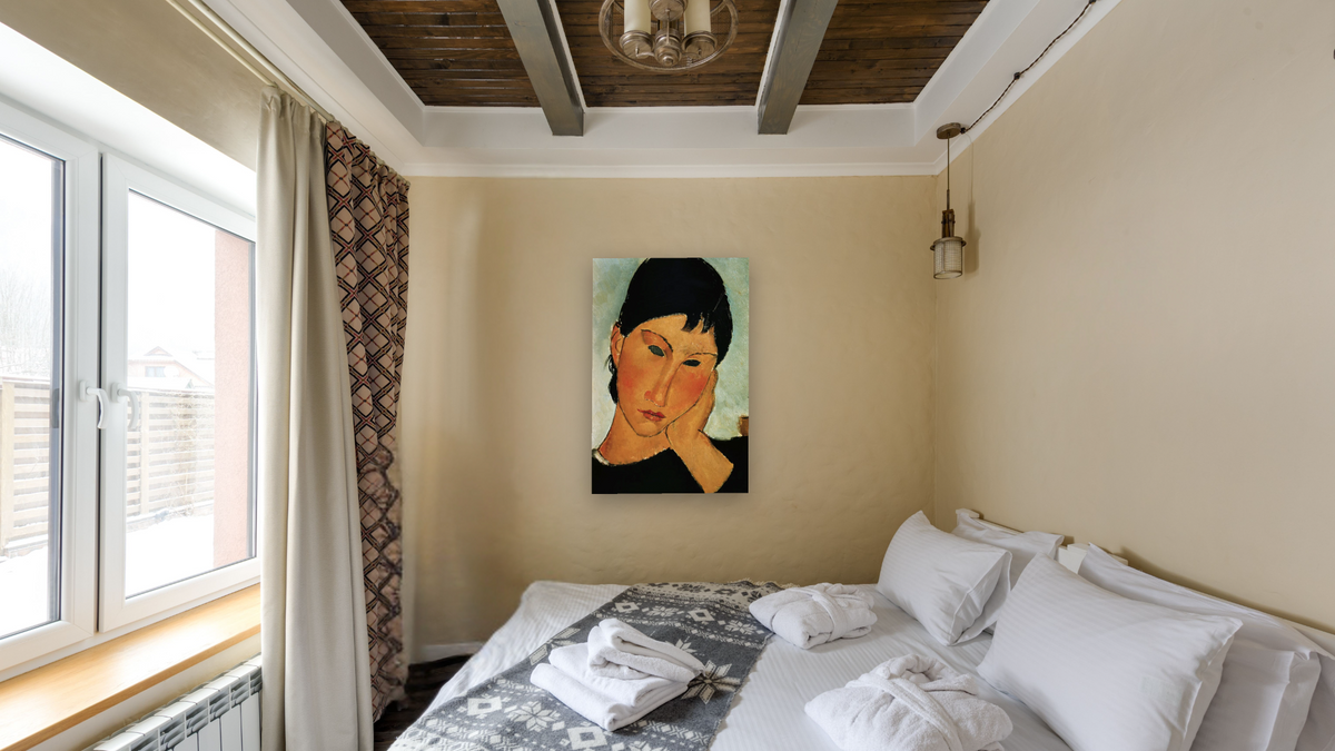 Detail of Female Head from Elvira Resting at a Table by Amedeo Modigliani, shown at 28 × 42 in (71.1 × 106.7 cm) as gallery-wrapped canvas, hotel guest room