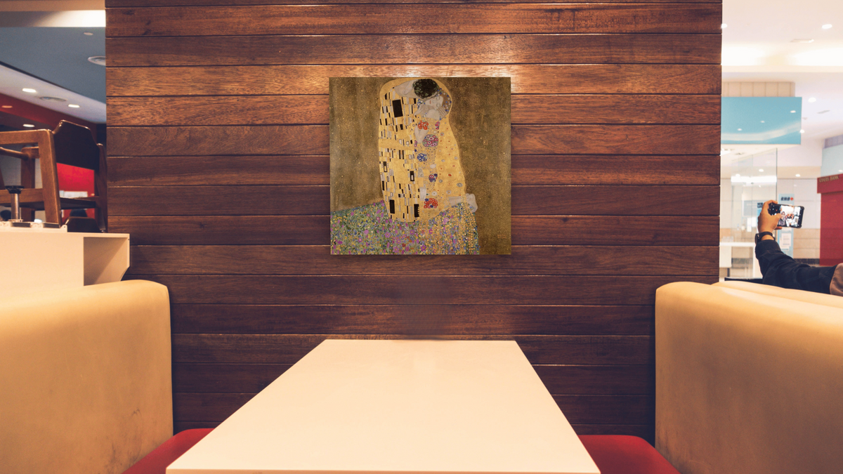 The Kiss by Gustav Klimt, shown at 32 × 32 in (81.3 × 81.3 cm) as gallery-wrapped canvas, restaurant