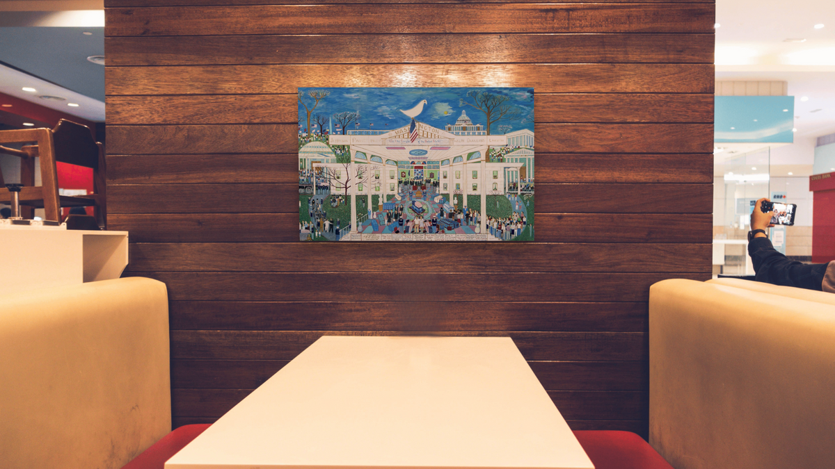 American Heritage by Ralph Fasanella, shown at 28 × 42 in (71.1 × 106.7 cm) as gallery-wrapped canvas, restaurant