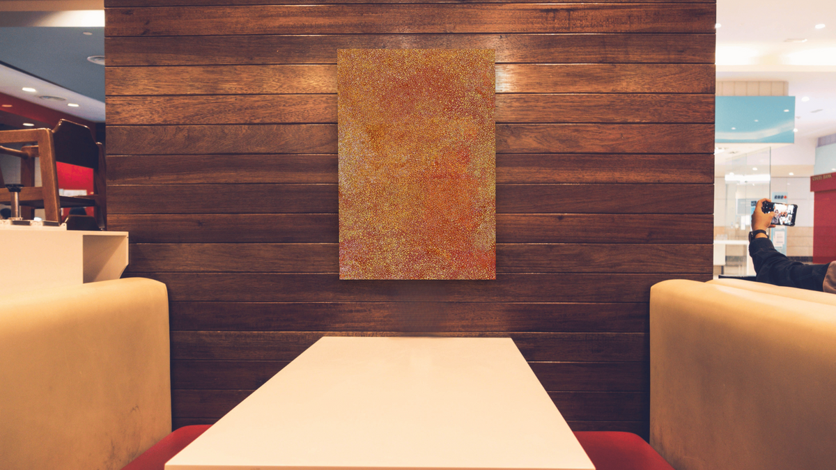 My Mother's Country, Emu Seed by Polly Ngale, shown at 28 × 42 in (71.1 × 106.7 cm) as gallery-wrapped canvas, restaurant