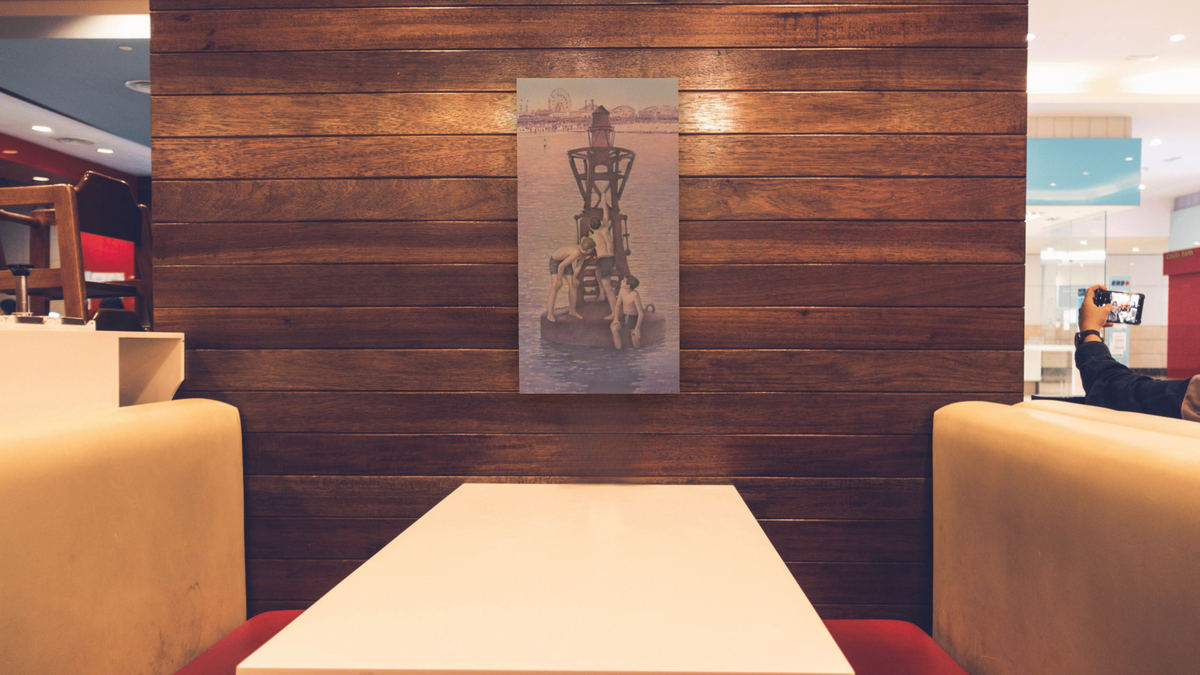 Now and Then: Franklin Library by Kirsten Söderlind, shown at 20 × 40 in (50.8 × 101.6 cm) as gallery-wrapped canvas, restaurant