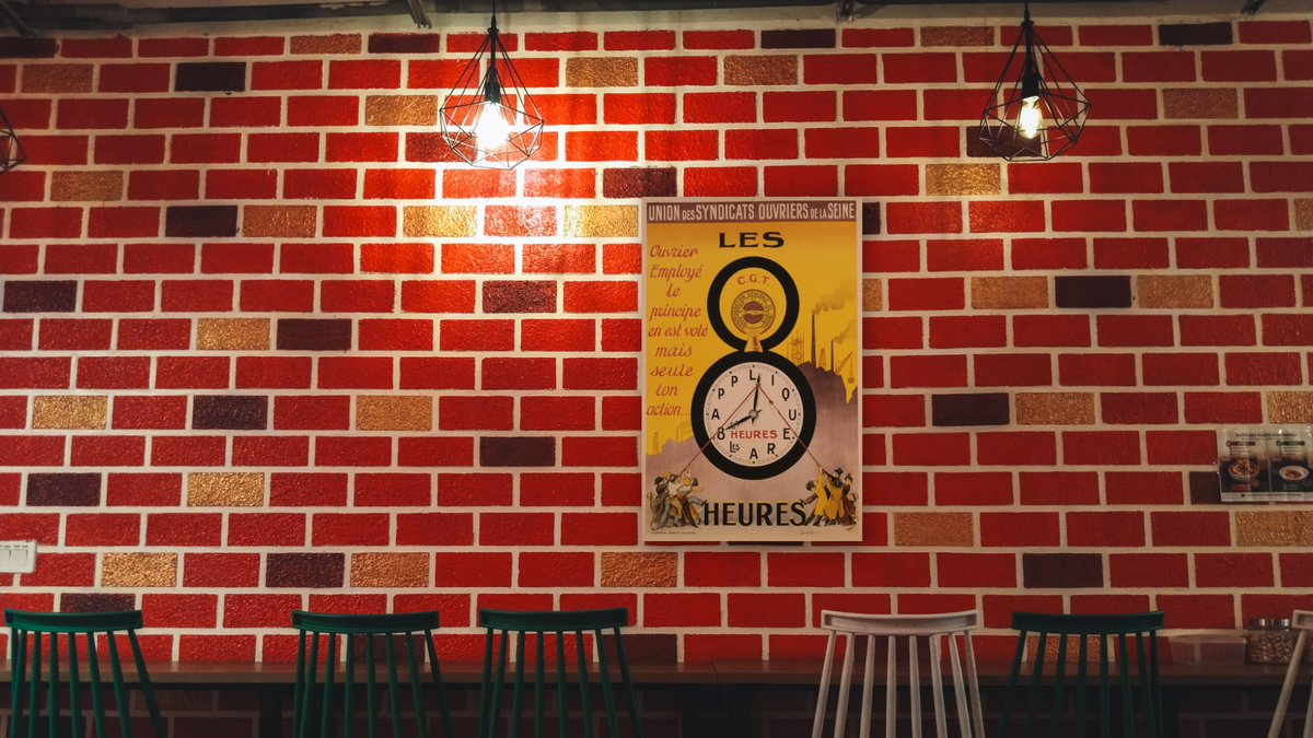 Les 8 Heures Work Incentive Poster by Doumenq, shown at 28 × 42 in (71.1 × 106.7 cm) as gallery-wrapped canvas, restaurant