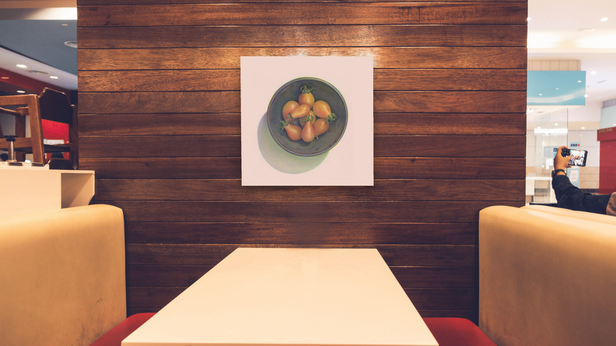 Yellow Tomatoes by Kirsten Söderlind, shown at 32 × 32 in (81.3 × 81.3 cm) as gallery-wrapped canvas, restaurant
