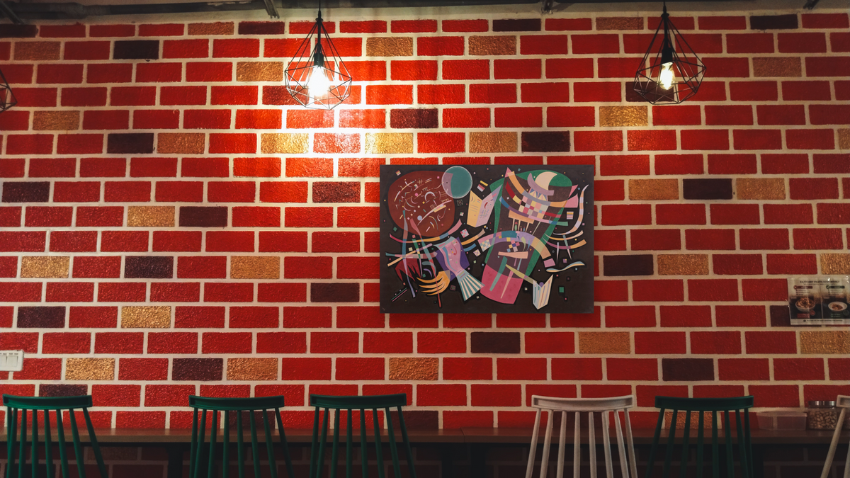 Composition X by Wassily Kandinsky, shown at 28 × 42 in (71.1 × 106.7 cm) as gallery-wrapped canvas, restaurant