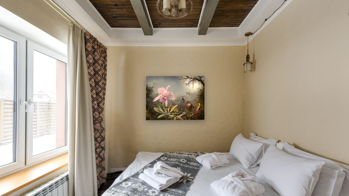 Cattleya Orchid and Three Hummingbirds by Martin Johnson Heade, shown at 30 × 40 in (76.2 × 101.6 cm) as gallery-wrapped canvas, hotel guest room