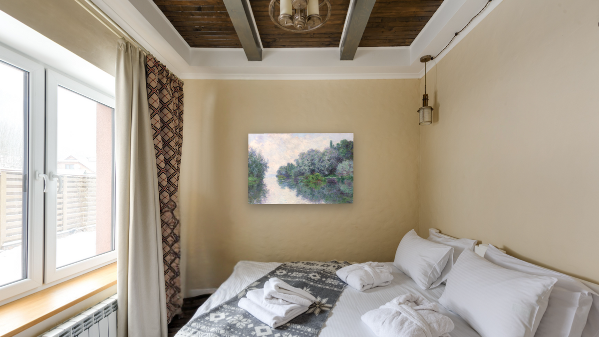 The Seine at Giverny by Claude Monet, shown at 28 × 42 in (71.1 × 106.7 cm) as gallery-wrapped canvas, hotel guest room