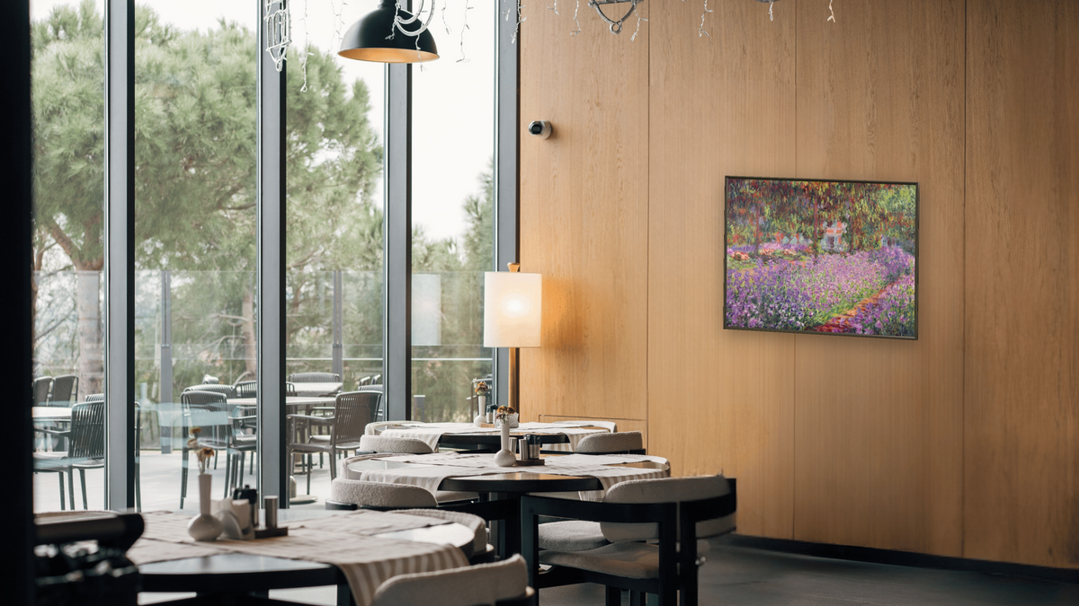 The Artist's Garden at Giverny by Claude Monet, shown at 32 × 40 in (81.3 × 101.6 cm) on canvas in Ramino Satin Black, restaurant