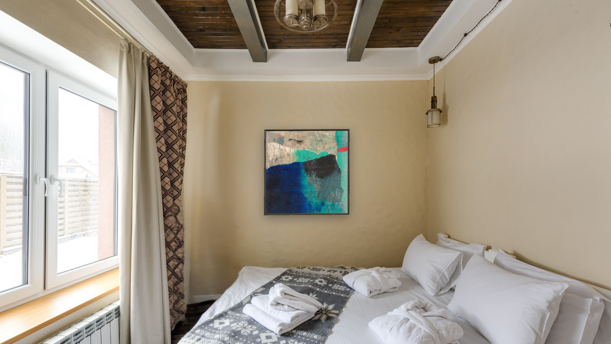 No. 108 by Michelle Oppenheimer, shown at 32 × 32 in (81.3 × 81.3 cm) on canvas in Ramino Satin Black, hotel guest room
