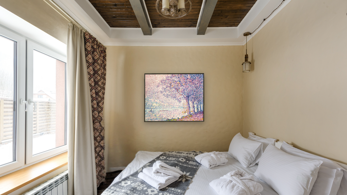 The Seine at St. Cloud by Paul Signac, shown at 32 × 40 in (81.3 × 101.6 cm) on canvas in Ramino Satin Black, hotel guest room