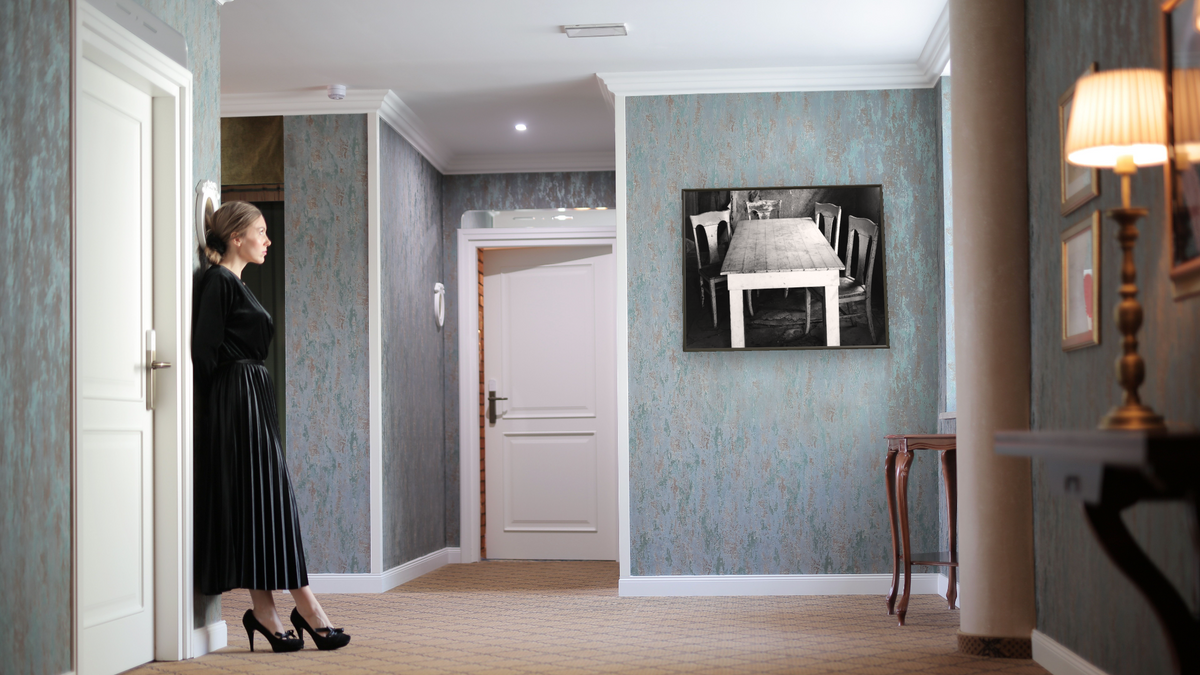 Table and Chairs by Gordon Osmundson, shown at 32 × 40 in (81.3 × 101.6 cm) on canvas in Ramino Satin Black, hotel lobby