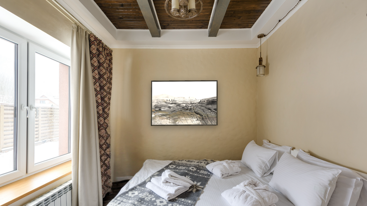 Coast by Dan Hobday, shown at 28 × 42 in (71.1 × 106.7 cm) on canvas in Ramino Satin Black, hotel guest room
