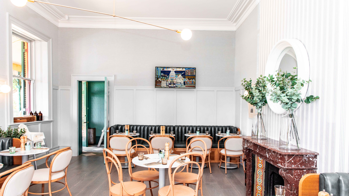 Ron's Rollin by Ralph Fasanella, shown at 20 × 40 in (50.8 × 101.6 cm) on canvas in Ramino Satin Black, restaurant