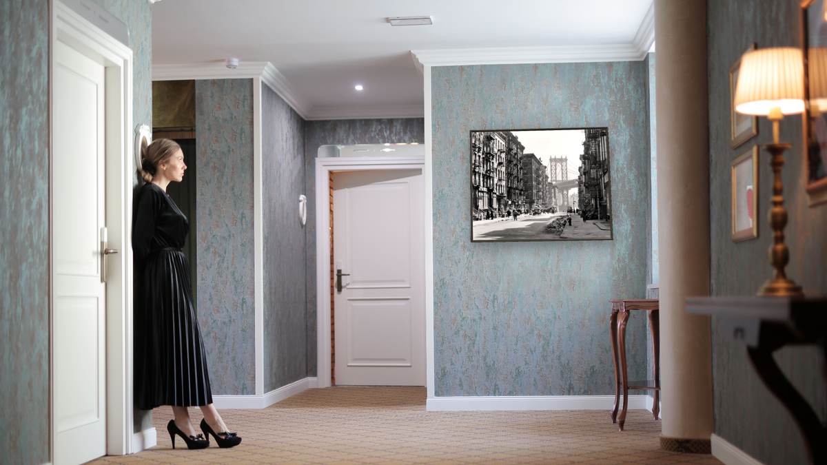 Pike and Henry Streets, Manhattan by Berenice Abbott, shown at 32 × 40 in (81.3 × 101.6 cm) on canvas in Ramino Satin Black, hotel lobby